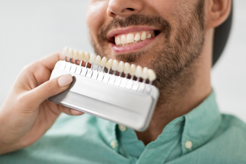 Patient looking for the right shade porcelain veneers in Frisco, TX